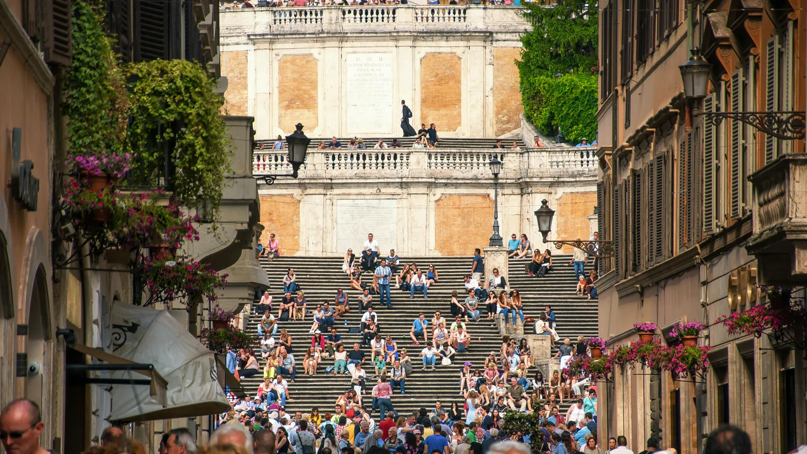A small piazza in Rione Monti at quiet hour, showing the sampietrini cobblestones and the gentle slope of the surrounding streets — useful context for visitors planning a wheelchair-accessible stay near the Colosseum.