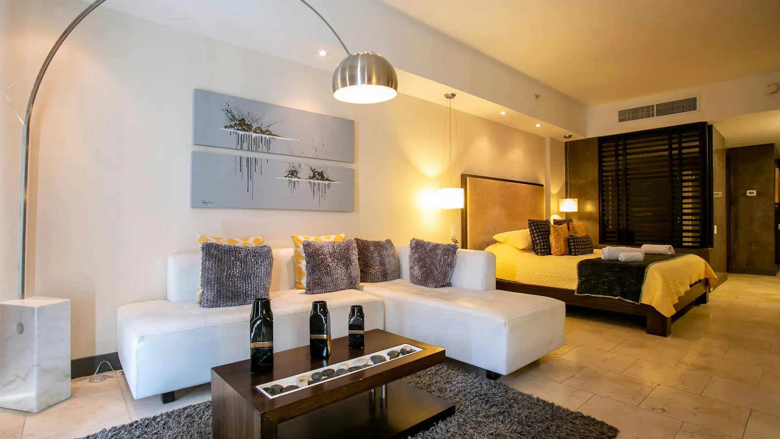 A 22-square-metre Superior Room at Hotel Colle Oppio in Rione Monti, with a queen bed, seating area, and luggage rack — the room category we recommend for families and stays of a week or more.